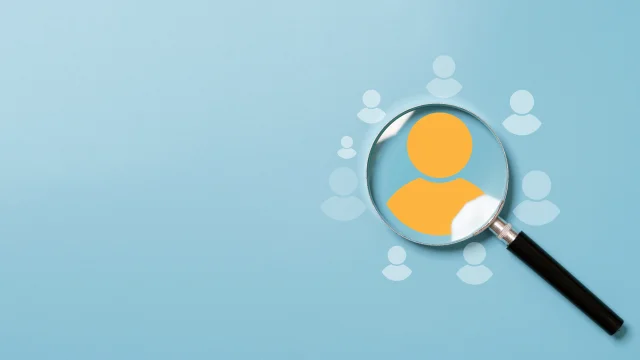Yellow human icon inside of magnifier glass among white icons for customer focus and customer relation management or CRM concept.